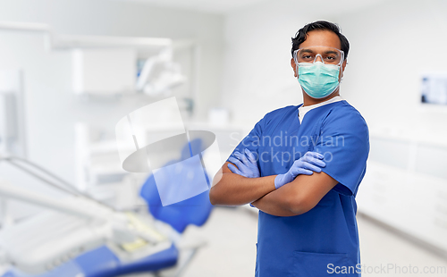 Image of indian male doctor in mask at dental office