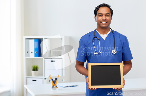 Image of happy indian male doctor or nurse with chalkboard