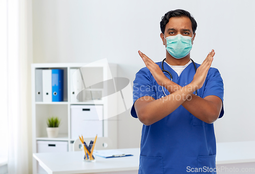 Image of indian male doctor mask showing refusal gesture
