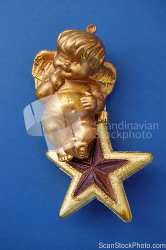 Image of little angel on golden star