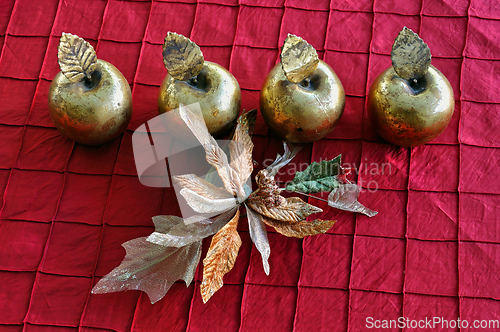 Image of golden apples and flower christmas decoration