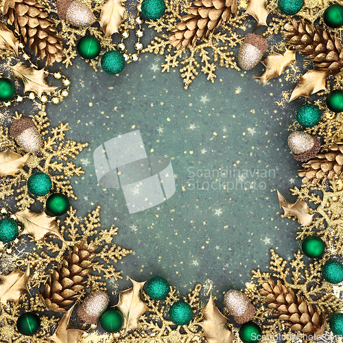 Image of Christmas Festive Gold Snowflake and Green Bauble Background