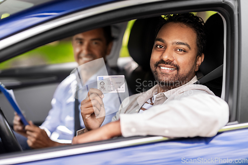 Image of car driving instructor and driver with license