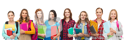 Image of teenage student girls with bags and notebooks