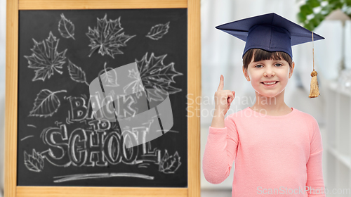 Image of little student girl in bachelor hat or mortarboard