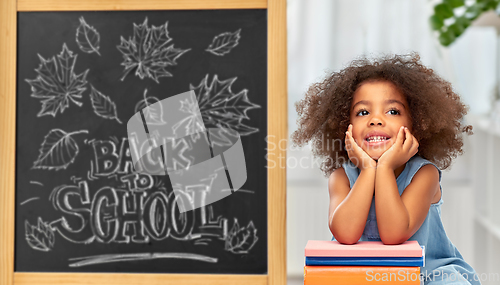 Image of little african american student girl with books