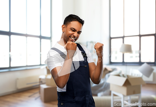 Image of happy worker celebrating success at new home