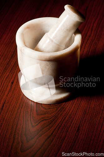 Image of Marble mortar and pestle on dark