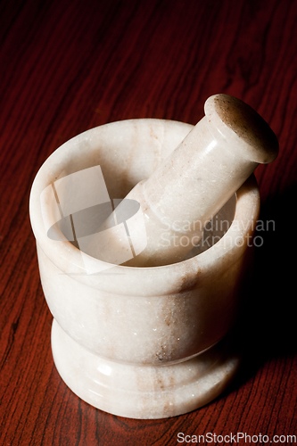 Image of Marble mortar and pestle on dark