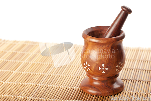 Image of Wooden mortar with pestle