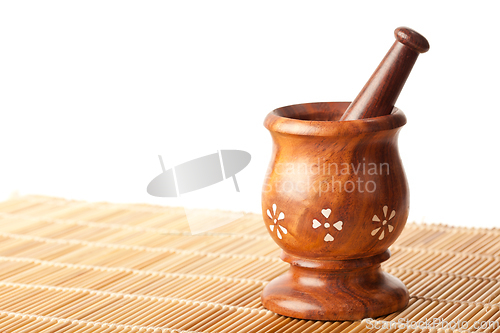 Image of Wooden mortar with pestle