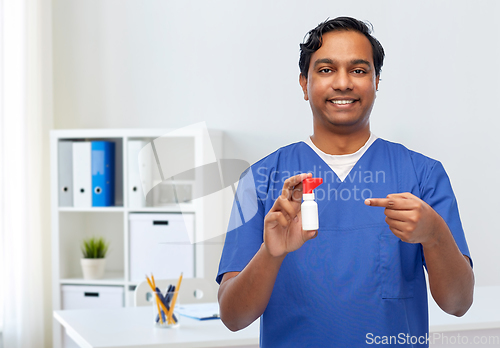 Image of smiling indian male doctor or nurse with medicine