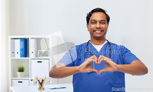 Image of indian doctor with stethoscope showing hand heart