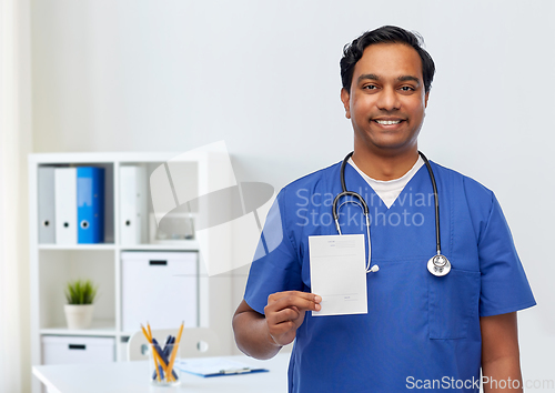 Image of indian doctor or male nurse with prescription