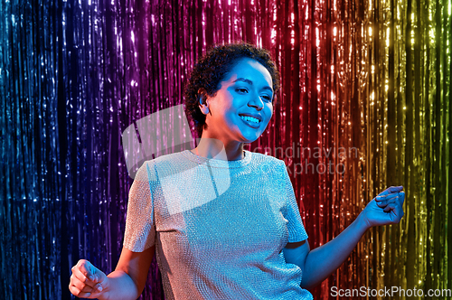 Image of african american woman dancing at party