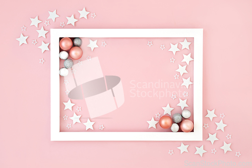 Image of Christmas Pink Background with Stars and Tree Deciorations