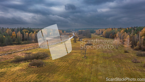 Image of Partly abandoned meadows under cloudy sky