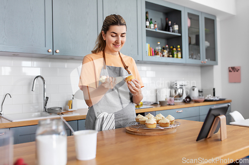 Image of woman cooking food and baking on kitchen at home