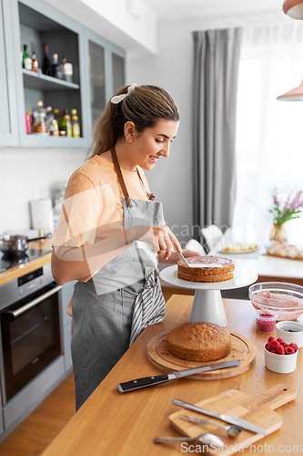 Image of woman cooking food and baking on kitchen at home