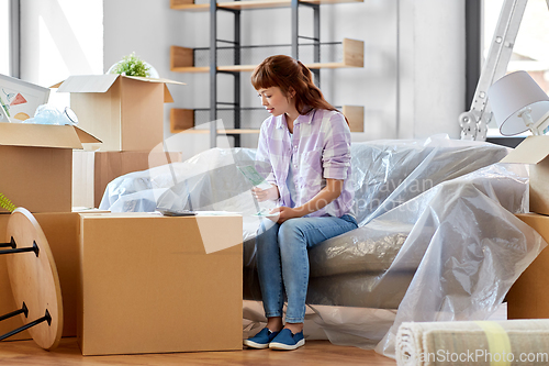 Image of asian woman moving to new home and counting money