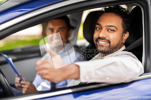 Image of smiling driver and car driving school instructor