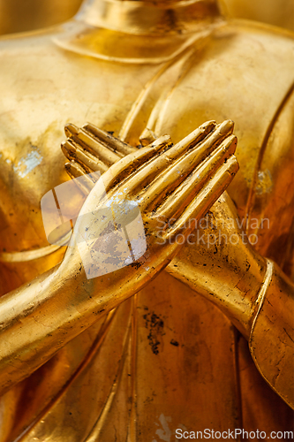 Image of Buddha statue hands close up