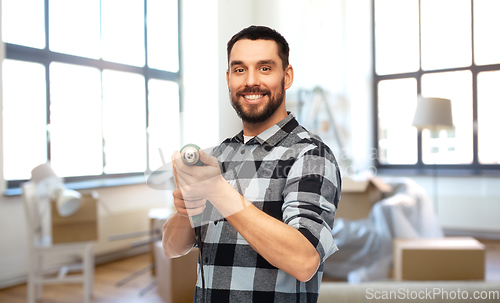 Image of happy man, worker or builder with drill at home