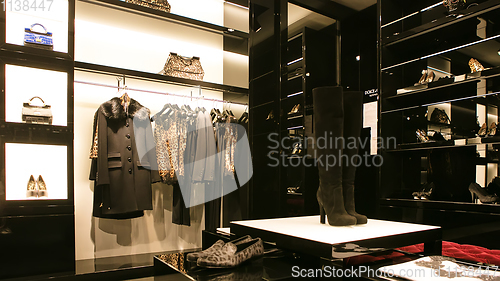 Image of bright and fashionable interior of shoe store in modern mall