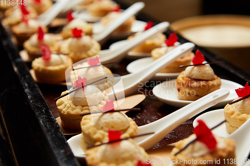 Image of Canapes with dessert on the banquet table.