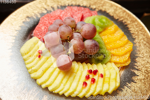 Image of Plate with mixed fruits. Shallow dof.