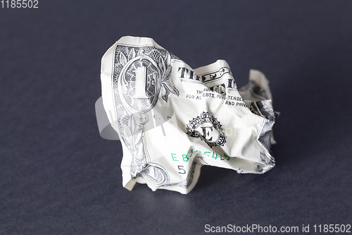 Image of one crumpled American dollar