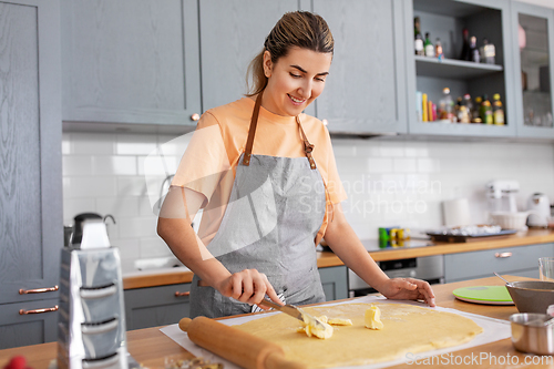 Image of woman cooking food and baking on kitchen at home