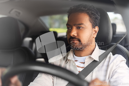 Image of indian man or driver driving car