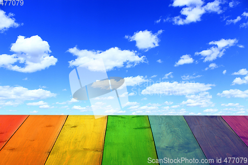 Image of multicolored bright stand from wooden boards and sky