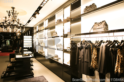 Image of bright and fashionable interior of shoe store in modern mall