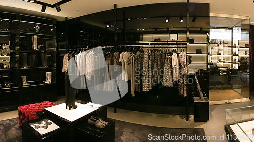 Image of bright and fashionable interior of shoe store in modern mall