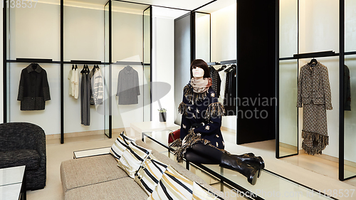 Image of fashionable interior of boutique in modern mall.