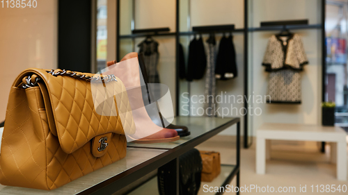 Image of fashionable interior of boutique in modern mall.