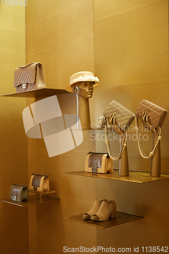 Image of fashionable interior of boutique in modern mall.