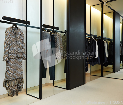 Image of fashionable interior of boutique in modern mall.