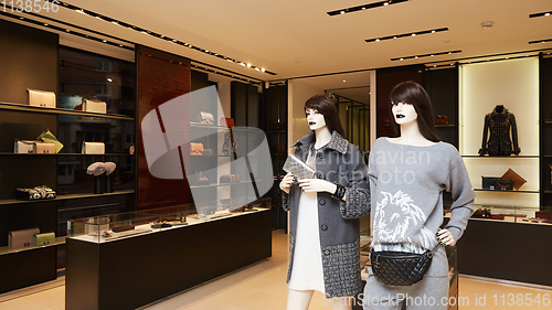 Image of fashionable interior of boutique in modern mall.