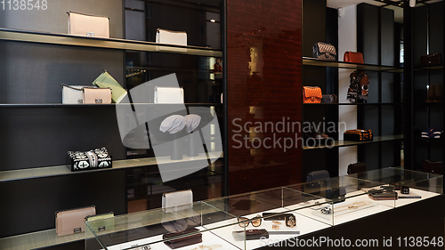 Image of fashionable interior of boutique in modern mall.