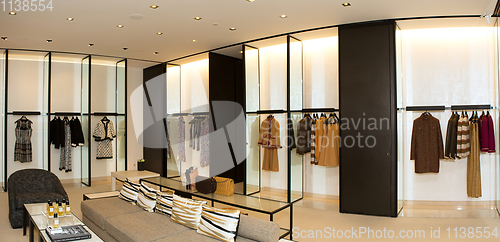 Image of fashionable interior of boutique in modern mall.