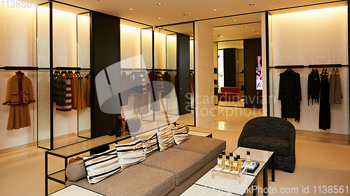 Image of fashionable interior of boutique in modern mall.