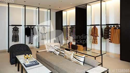 Image of fashionable interior of boutique in modern mall.