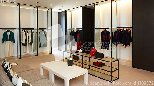 Image of fashionable interior of boutique in modern mall.