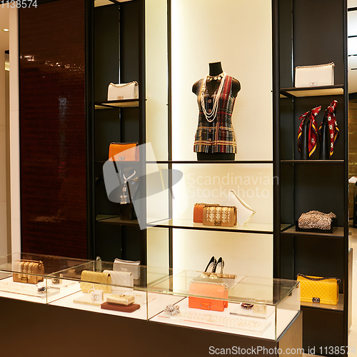 Image of fashionable interior of boutique in modern mall.