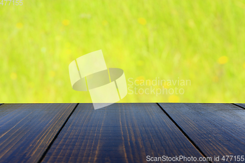 Image of table from wooden boards with natural background