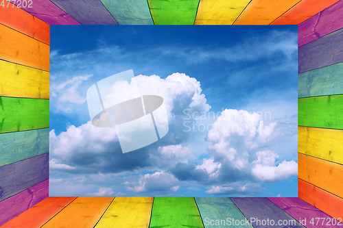 Image of multicilored frame and cloudy sky in the middle