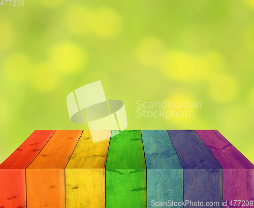 Image of multicolored wooden boards with blurred lights